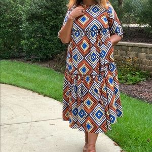 Diamond print crepe tiered shift dress..